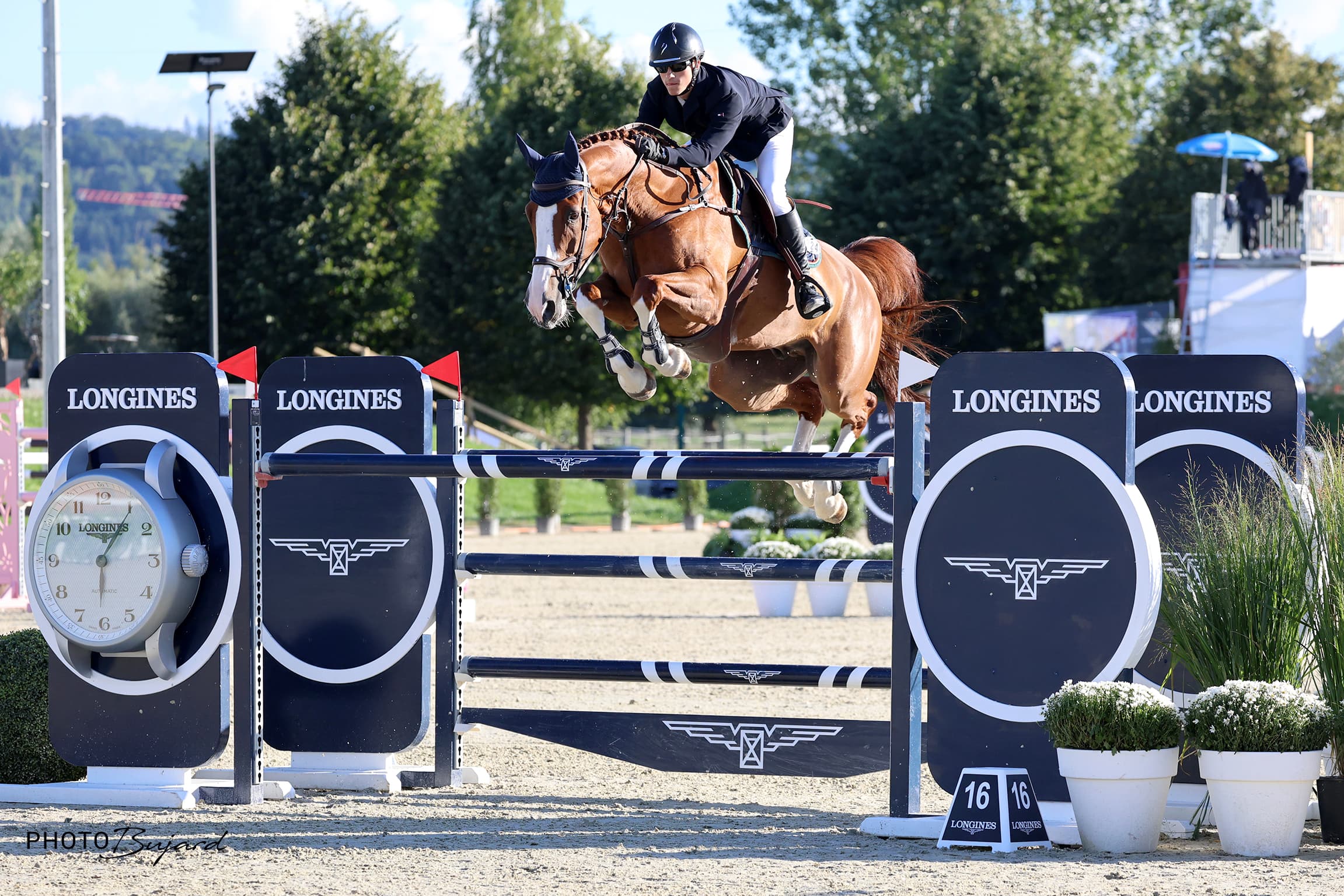 Bryan Smits on course over a Longines fence
