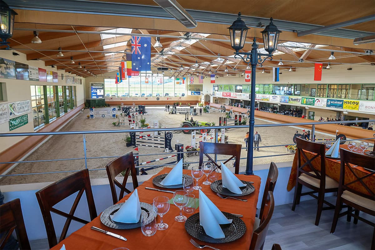 A table on the restaurant balcony above the ring