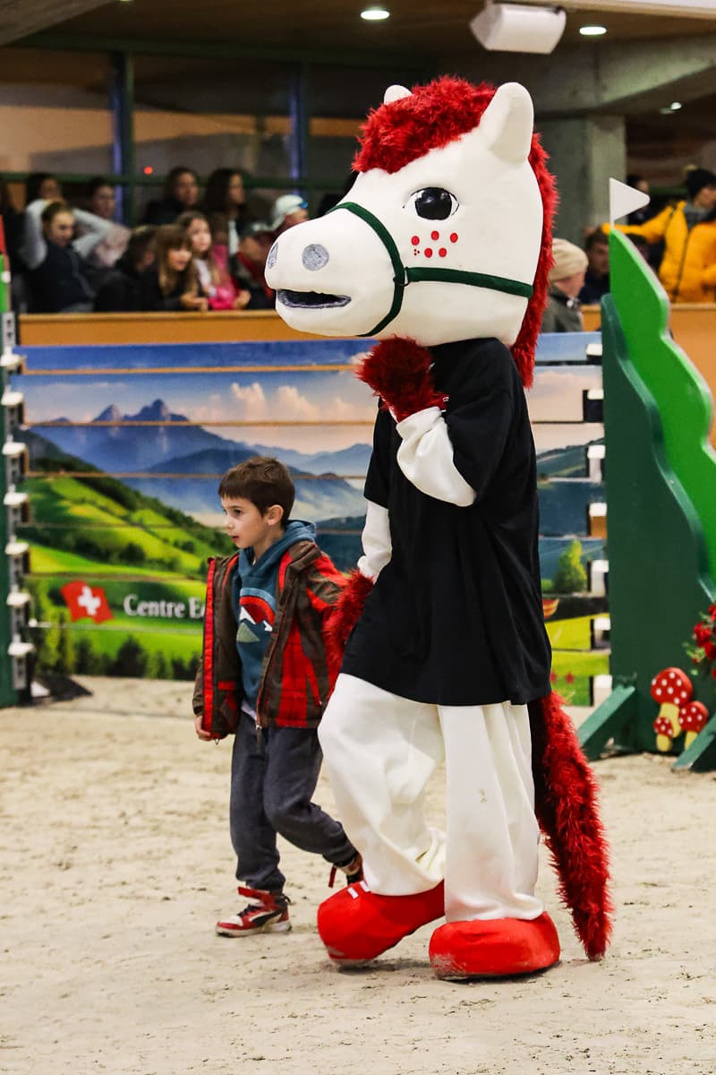 The mascot with a young fan
